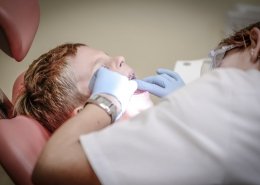 Dental surgeon performing extraction